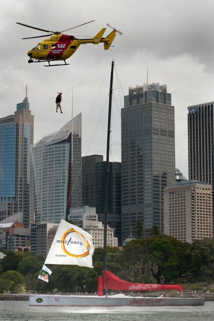 Going up! A simulated rescue operation for Rolex Sydney Hobart race record holder, Wild Oats XI, sees a crewman winched to safety by the Westpac Life Saver Rescue Helicopter on Sydney Harbour today. - Rolex Sydney Hobart Yacht Race 2011 ©  Andrea Francolini Photography http://www.afrancolini.com/